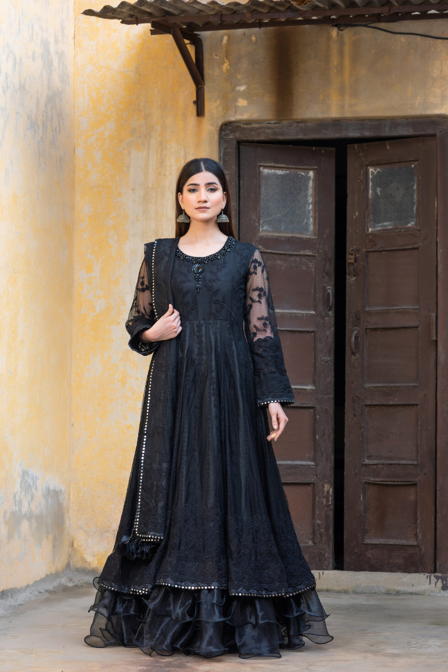 Black embroidered maxi with handwork on neckline and full sleeves adorned with fine thread embroidery and sequence lace.